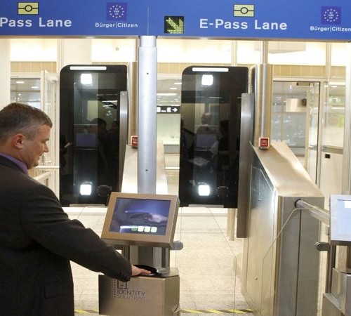 A man puts his biometric passport on a scanner at an automatic border control point during a media presentation at Zurich-Kloten airport December 1, 2010. The machine, designed to replace passport control officers, can align the data of biometric passports of travellers from Switzerland or EU countries leaving the Schengen area, to image scans taken of the passenger's face. If they match, they may cross the border. The system begins a six-month trial today.  REUTERS/Arnd Wiegmann (SWITZERLAND - Tags: TRAVEL TRANSPORT IMAGES OF THE DAY) - BM2E6C11AR701