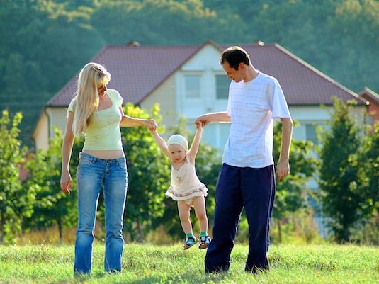 Happy family on meadow