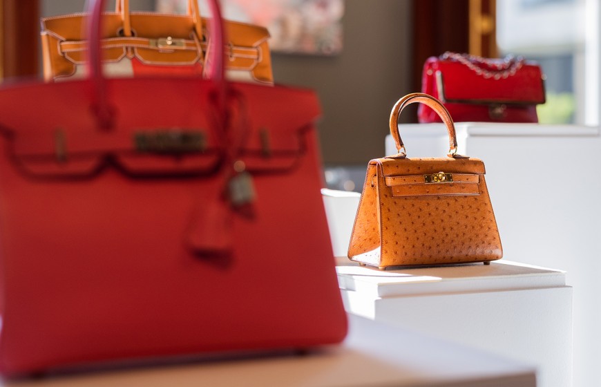 02 September 2021, North Rhine-Westphalia, Cologne: Luxury handbags by Louis Vuitton, Chanel and Hermes , Birkin Bag (front) and Mini Birkin (r) , are on display at Sotheby's new German branch. The auction house intends to hold regular auctions in Germany from Cologne in the future. To this end, it has expanded the palatial Palais Oppenheim into its new headquarters in recent months. Cologne will become Sotheby's sixth auction location in Europe, following London, Paris, Geneva, Zurich and Milan. Photo: Rolf Vennenbernd/dpa (Photo by Rolf Vennenbernd/picture alliance via Getty Images)